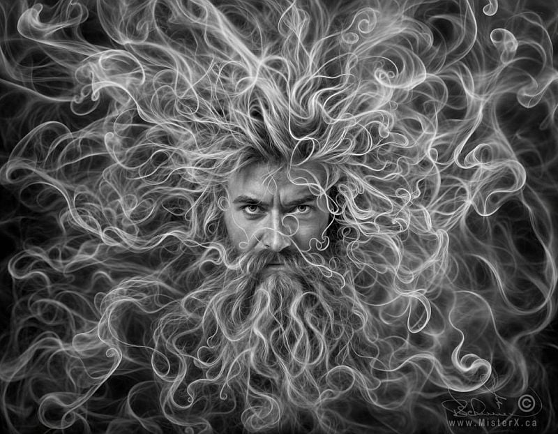 This hyperrealistic photograph shows a bearded man's face emerging from delicate wisps of smoke. His hair, moustache and beard blending into the smoke seamlessly, with the ends of the hair all turning into the smoke. All of the outer edges of this black and white image are pure wisps of smoke only. Extremely original fantasy image is psychedelic and surreal.